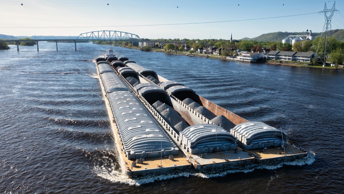 River barge in Danube navigation lock — inland waterway transport by ICTS Logistic